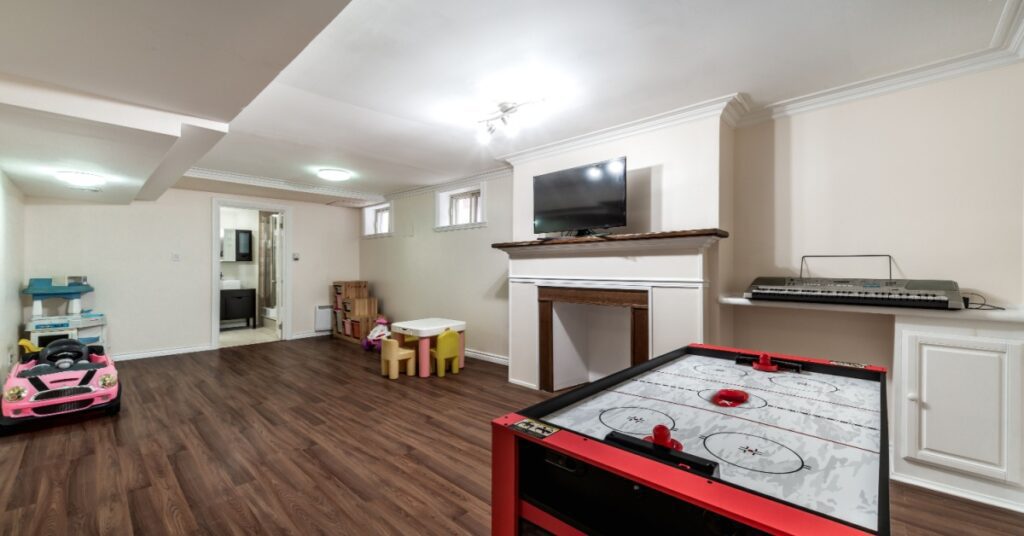 4 Mold-Resistant Paint Options for Bathrooms and Basements 1 basement with fireplace, hockey game wood floor,